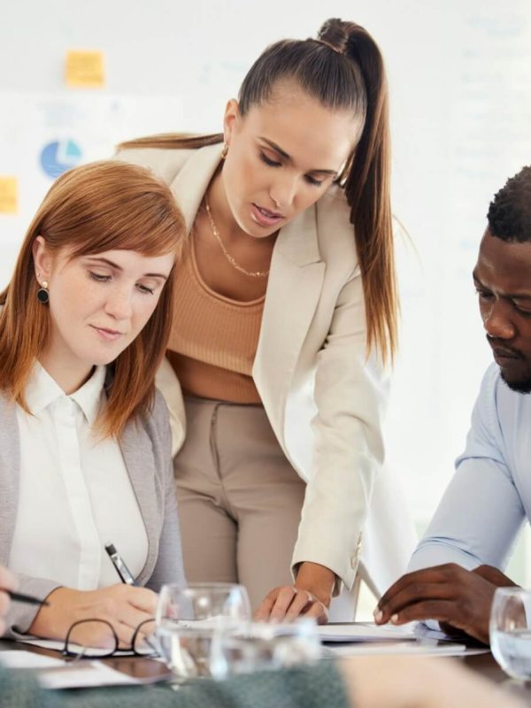business-people-financial-and-meeting-at-a-table-with-serious-workers-planning-writing-and-prepar.jpg