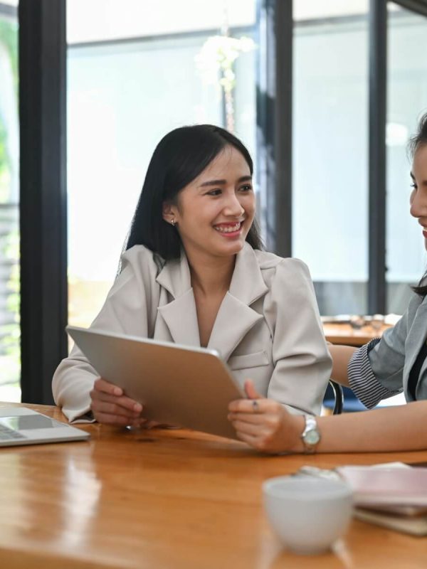 two-business-women-sharing-ideas-or-startup-business-plan-together-.jpg